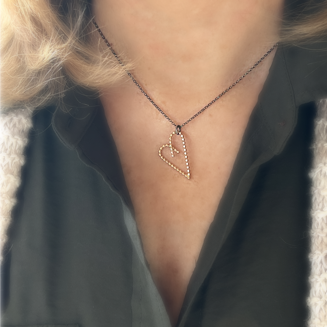 14k gold-filled asymmetric heart pendant with oxidized necklace on Model