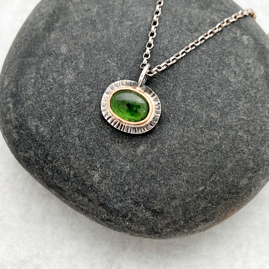 Oval Green Tourmaline Pendant Necklace in 14k yellow gold and silver