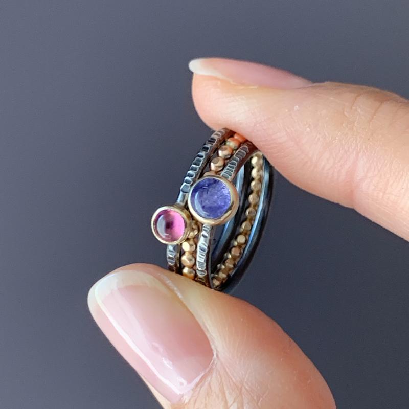 Gold and Oxidized gemstone stacking rings with Tourmaline, moonstone, and tazanite